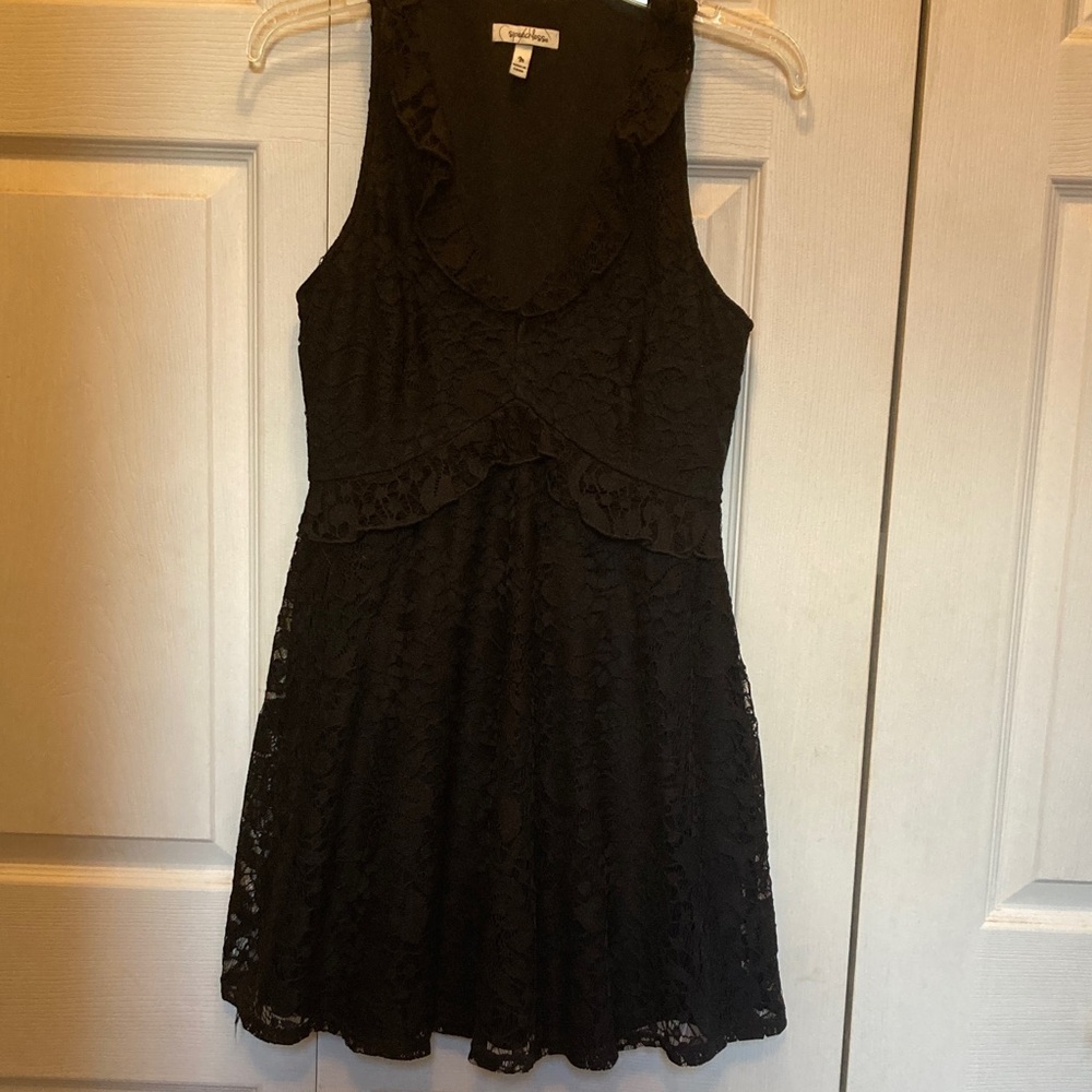 Cute little black Dress ..  size M, fits more like a Small. Ruffled V Neckline
